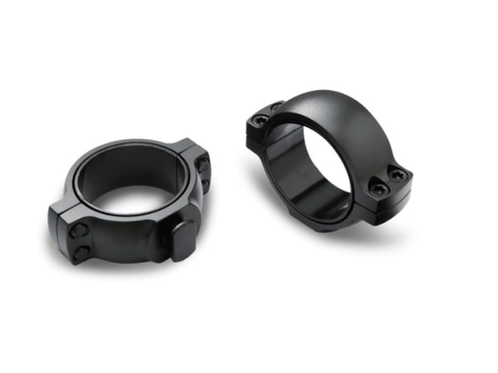 Two black metal scope rings on white background