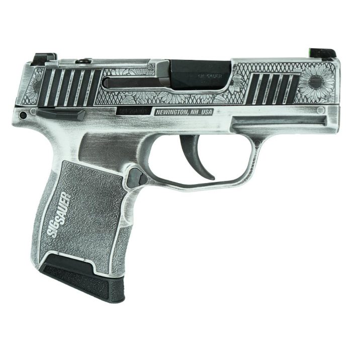 Silver engraved Sig Sauer pistol on white background