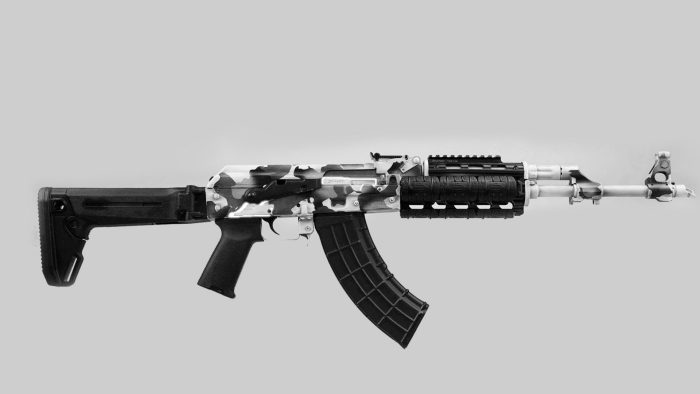 Black and silver assault rifle on gray background