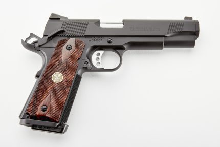 Black Tactical Elite handgun with wood grips