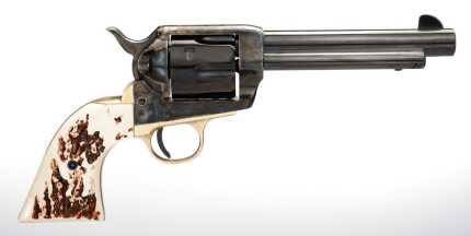 Antique revolver with ornate ivory handle