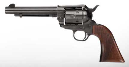 Classic revolver with wooden grip on white background