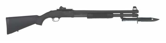 Black tactical shotgun with mounted bayonet side view