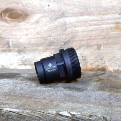 Gemtech 18x1mm black muzzle brake on wooden surface.