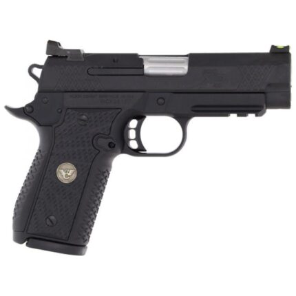 Black compact handgun with tactical sights