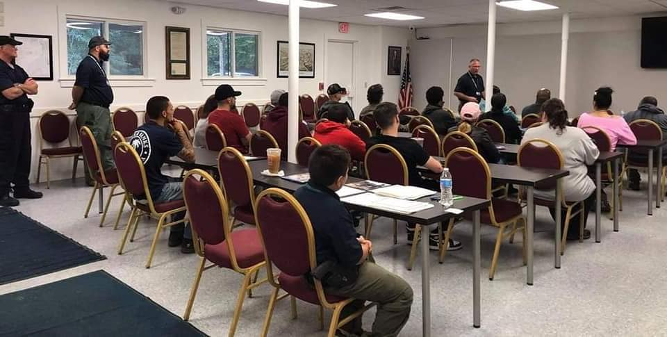 Students participating in a Massachusetts firearms safety course, learning safe gun handling techniques.