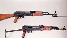 Close-up of a bump stock device attached to an AR-15 style rifle