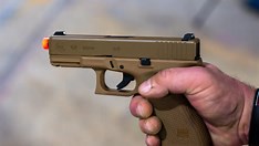 Glock 47 semi-automatic pistol on shooting range bench