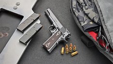 Springfield Armory Garrison Target 1911 pistol with adjustable sights on a range.