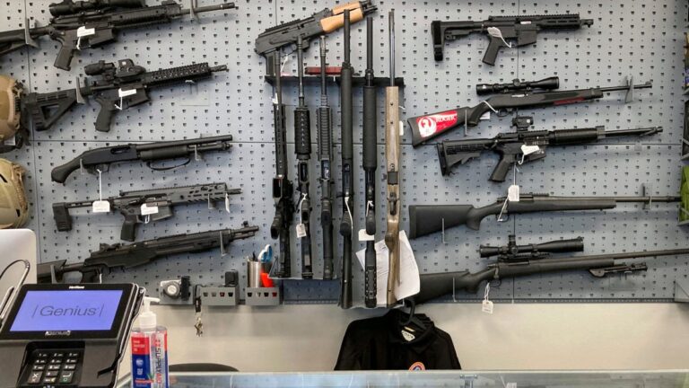 A customer filling out paperwork at a licensed firearms dealer for an online transfer