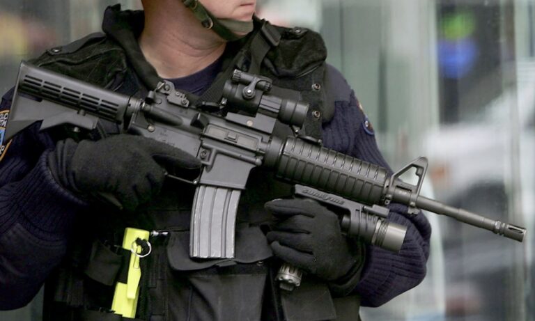 A professional-grade M4 carbine mounted in a secure vehicle setting