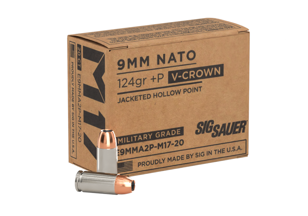 Close up of 9mm hollow point defensive ammunition next to a modern handgun