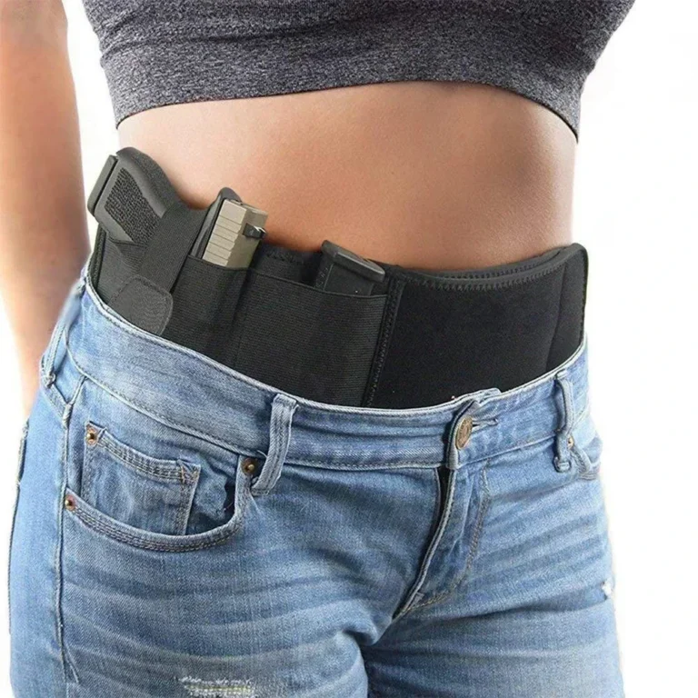 A person wearing a professional leather handgun holster on a belt for concealed carry