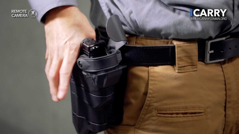 A black Level 3 duty duty holster mounted on a tactical duty belt