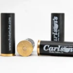Carlson's Dummy 12ga Shotgun Snap Caps, black and brass caps shown upright, flat and on side