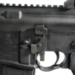 TROY AMBI BOLT RELEASE BLK, close-up of black release mounted on a black rifle receiver