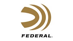 Close up of Federal Tactical Bonded rifle ammunition brass cases on a tactical surface