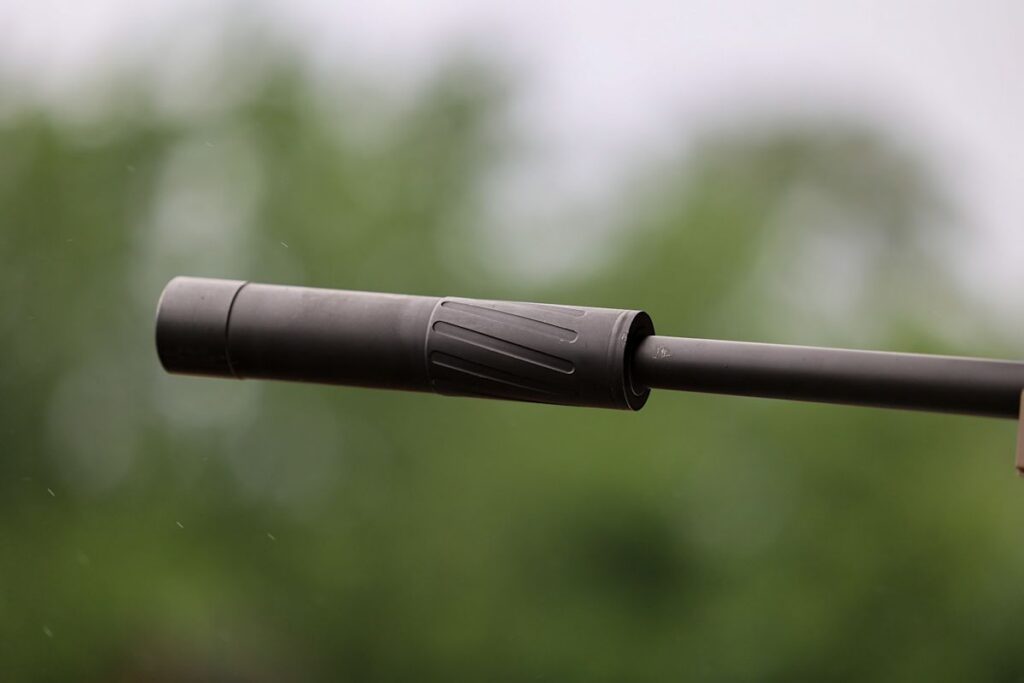 Firearm suppressors displayed at a licensed gun dealer sales counter