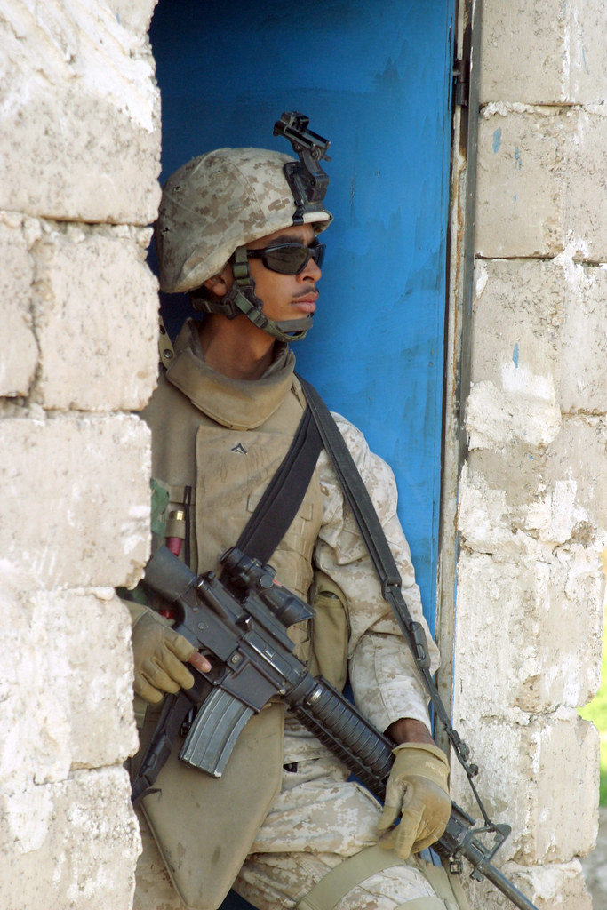 Modern AR-15 rifle equipped with red dot sight and tactical light for home defense
