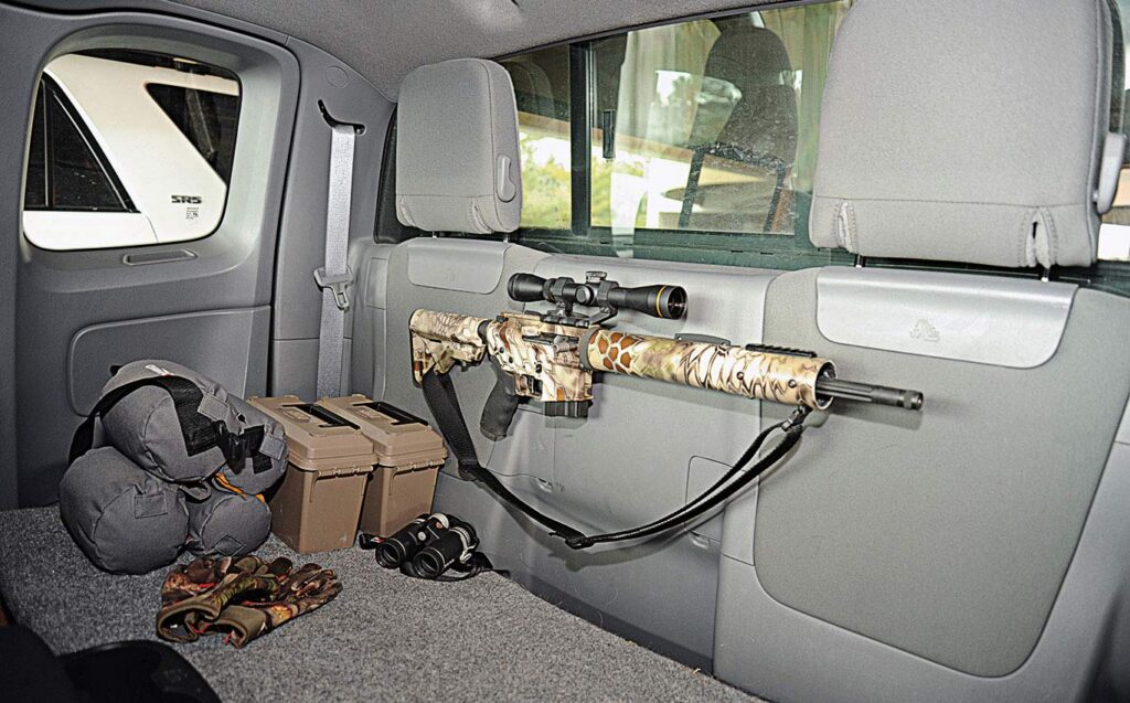A steel vehicle safe installed inside a truck cabin to prevent firearm theft
