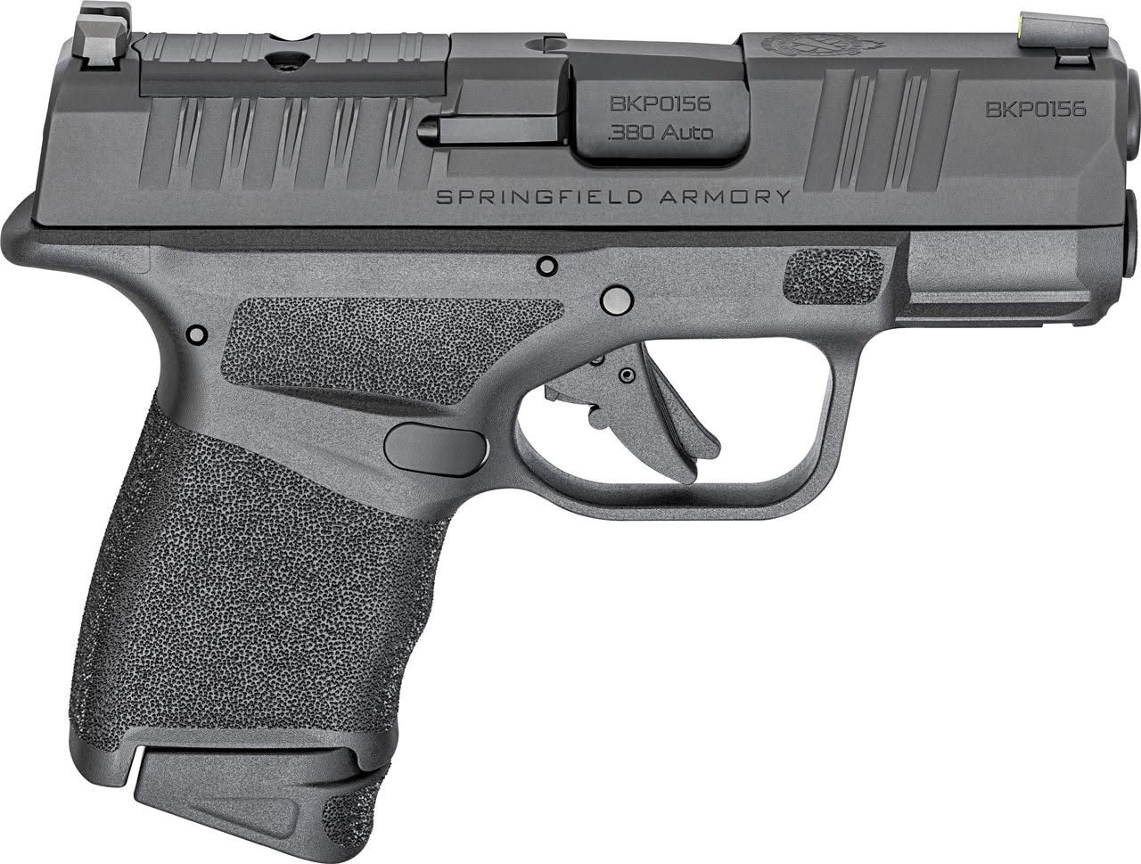 A compact .380 ACP semi-automatic pistol resting on a wooden surface