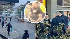 Police officers conducting an arrest near a restaurant in a city district