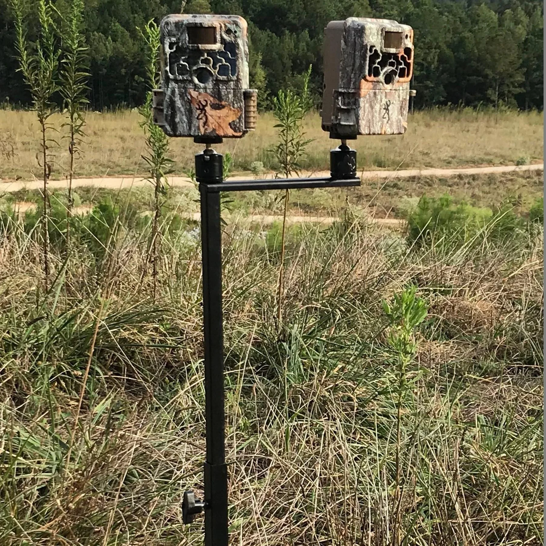 browning-trail-camera-field-mount-primary Browning Trail Camera Field Mount holding two camouflage trail cameras in a grassy field