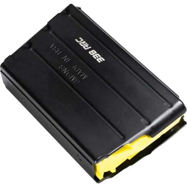 CMMG AR-15 Magazine, black angled view with ribbed body and yellow follower