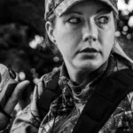 GSM Halo XL600 6x Rangefinder, black-and-white view of a person holding the device outdoors
