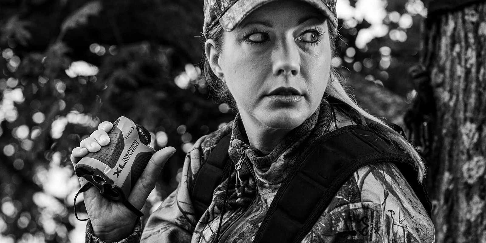 halo-xl600-6x-rangefinder-600yd-angle-intel-primary GSM Halo XL600 6x Rangefinder, black-and-white view of a person holding the device outdoors