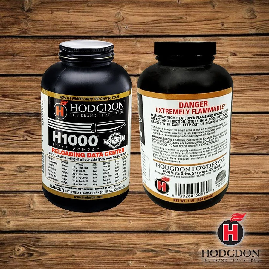 hodgdon-rifle-powder-1-lb-primary Hodgdon Extreme H1000 Rifle Powder, black bottle shown from front and back on wood
