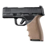 Hogue HandAll Beaver Tail Grip Sleeve FDE sleeve fitted to a black handgun, left-side view