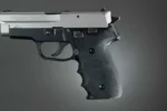 Hogue SIG Sauer P228 - P229 Rubber Grips, black finger-groove grip mounted on handgun
