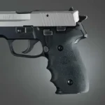 Hogue SIG Sauer P228 - P229 Rubber Grips, black finger-groove grip mounted on handgun