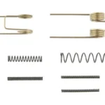 KAK Industry AR-15 LPK Spring Kit, assorted silver and brass-colored springs arranged in rows