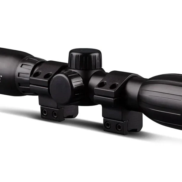 Konus KONUSFIRE 4x32mm Rifle Scope, black angled side view with adjustment turrets and mounting rings