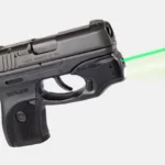 LaserMax Green Ruger GripSense Laser for LC9 LC9S LC380 EC9S, mounted on black pistol with green beam