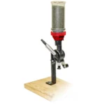 Lee Perfect Powder Measure, clear hopper and black dispenser mounted on a wooden base