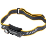 FENIX HM23 V2 black headlamp, angled side view with cylindrical light and yellow-trimmed band