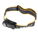 FENIX HM50R V2 black headlamp, angled side view with cylindrical light and yellow-trimmed band