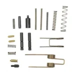 LBE AR ESSENTIALS KIT, assorted black and brass pins, springs and small parts arranged in rows