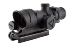 TRIJICON ACOG 4X32 LED black optic in front three-quarter view with mount and lens caps