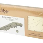 CBG CALIBER SHOT GUN WOOD PUZZLE tan retail box shown at an angle with puzzle illustrations