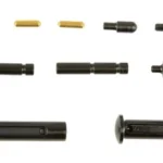 KAK AR-15 Pin and Detent Kit with black and brass components arranged in rows