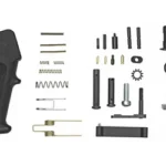 Luth-AR 308 Lower Receiver Parts Kit, top view of black grip, trigger and assorted small parts