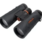 ATHLON MIDAS G2 UHD BINOCULARS black binoculars, angled front view, with orange accents