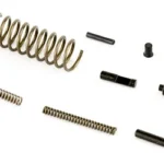CMMG PARTS KIT AR15 UPPER PINS/SPRNG with assorted black pins and metal springs laid out