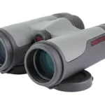 WINCHESTER SUPREME 10X42MM BINOCULAR gray binocular, angled front view with twin objective lenses