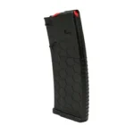HEXMAG SHRTY AR15 black magazine, angled side view with hexagonal texture and red follower