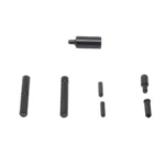 KNS TURNED DETENT LOWER PARTS KIT black pins and small parts arranged in rows